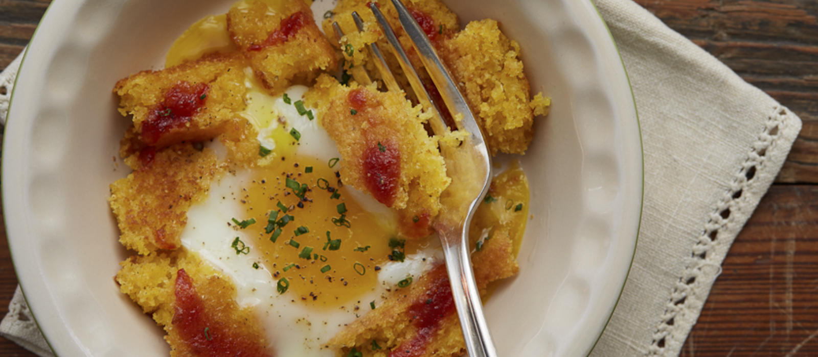 Baked Eggs with Blackberry Farm Tomato Jam and Toasted Cornbread