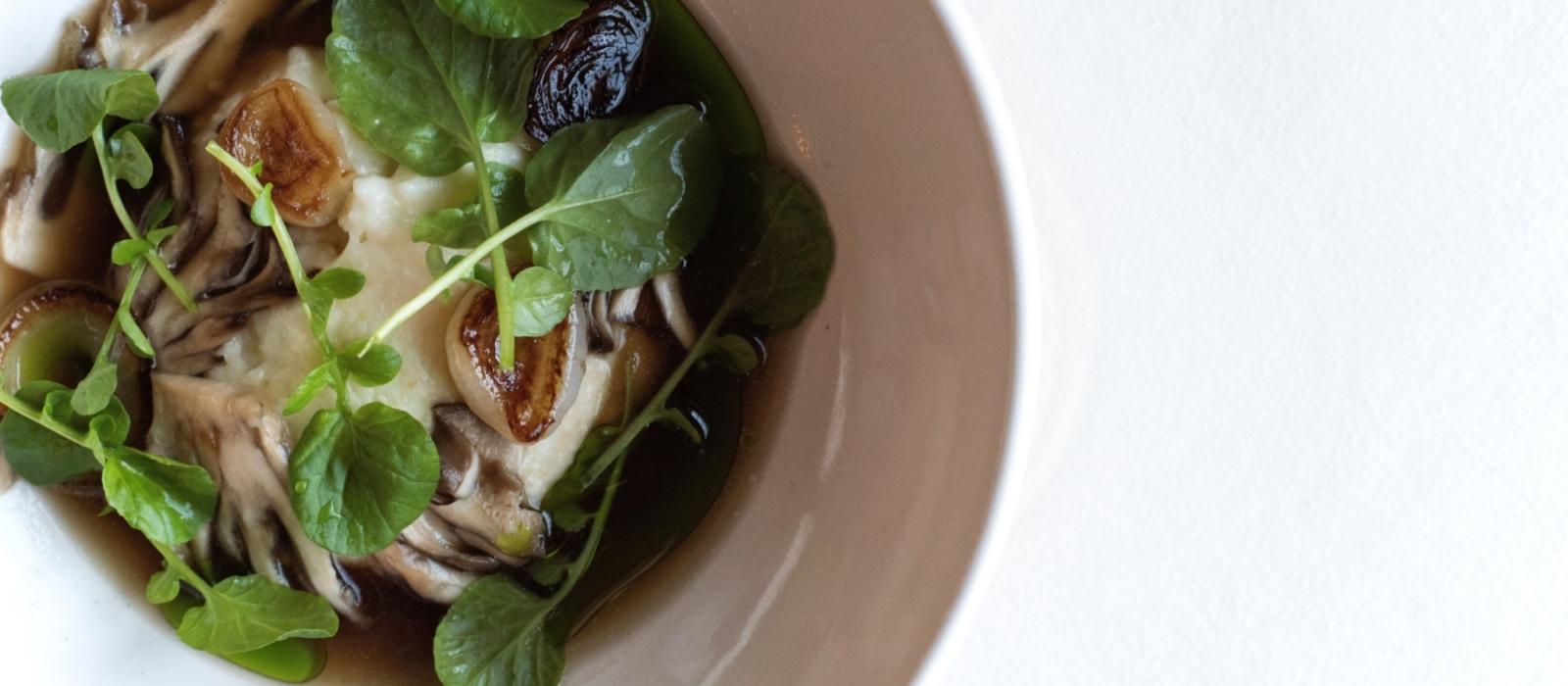 Grits with Benton’s Bacon Broth and Charred Onion