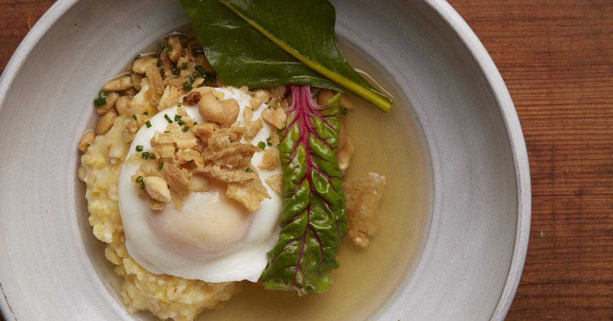Poached Farm Egg with smoked chicken broth and Anson Mills Grits