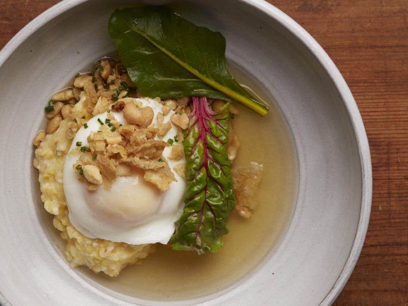 Poached Farm Egg with smoked chicken broth and Anson Mills Grits