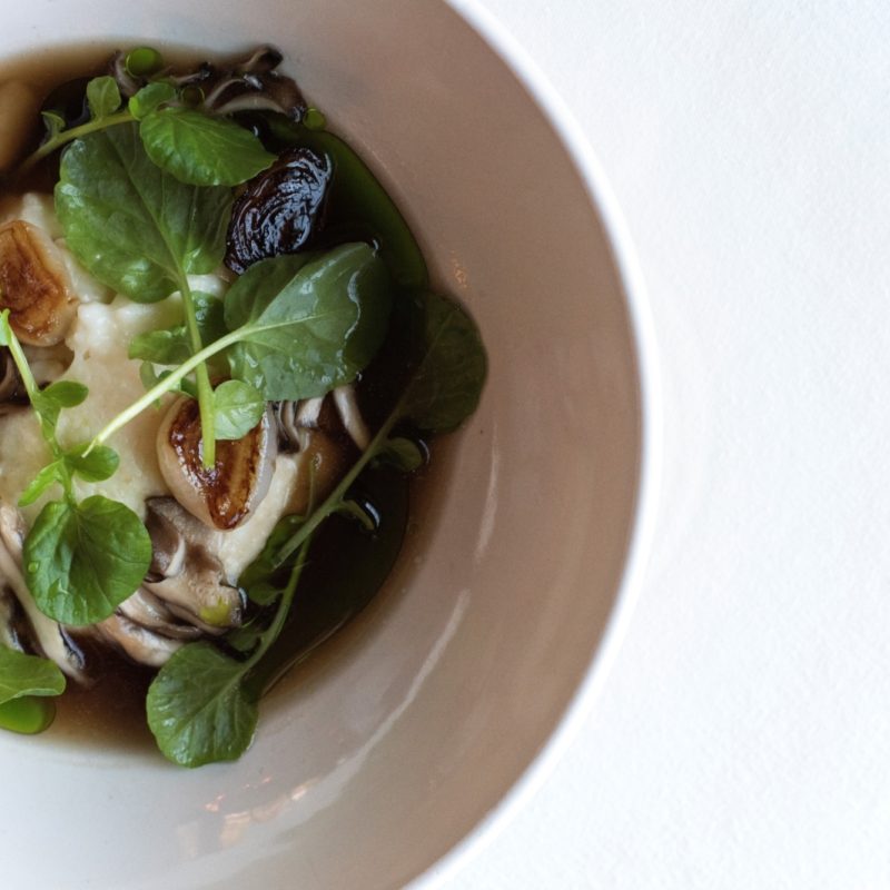 Grits with Benton’s Bacon Broth and Charred Onion