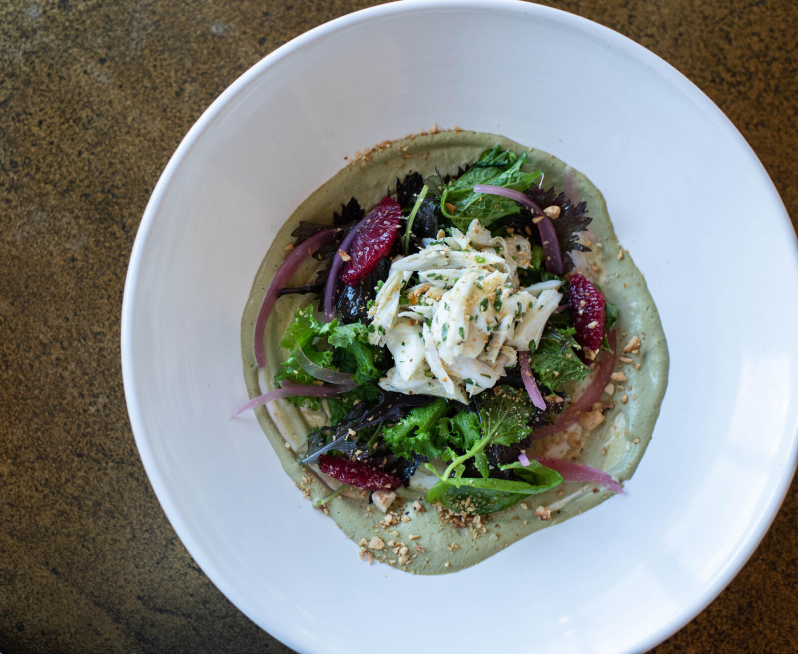 Lemon Poached Alabama Crab Salad, Bitter Greens, Tapenade Aioli, Hazelnut and Pickled Onions, Executive Chef Bonnie Moore